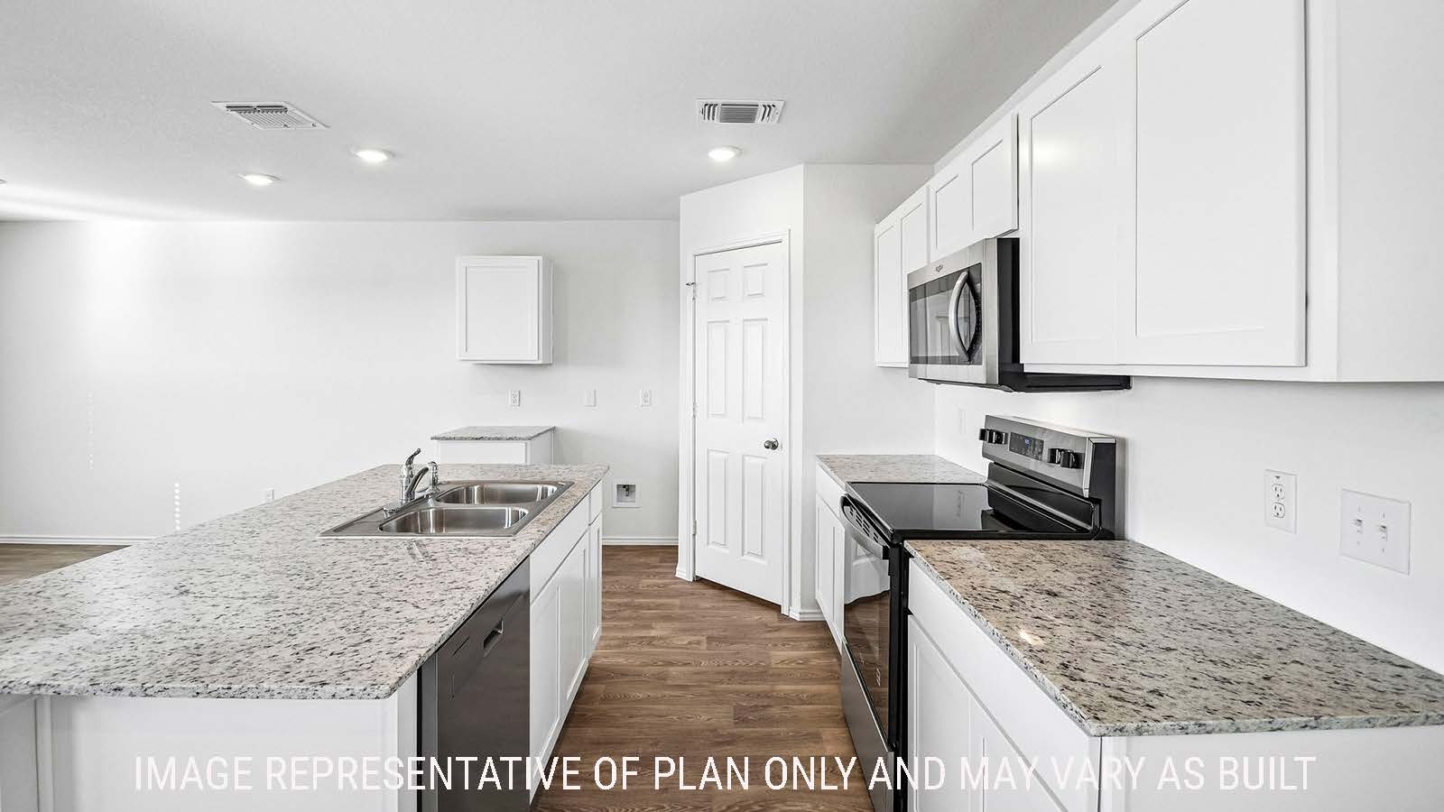 Iris kitchen with kitchen island with white cabinets and granite countertops.