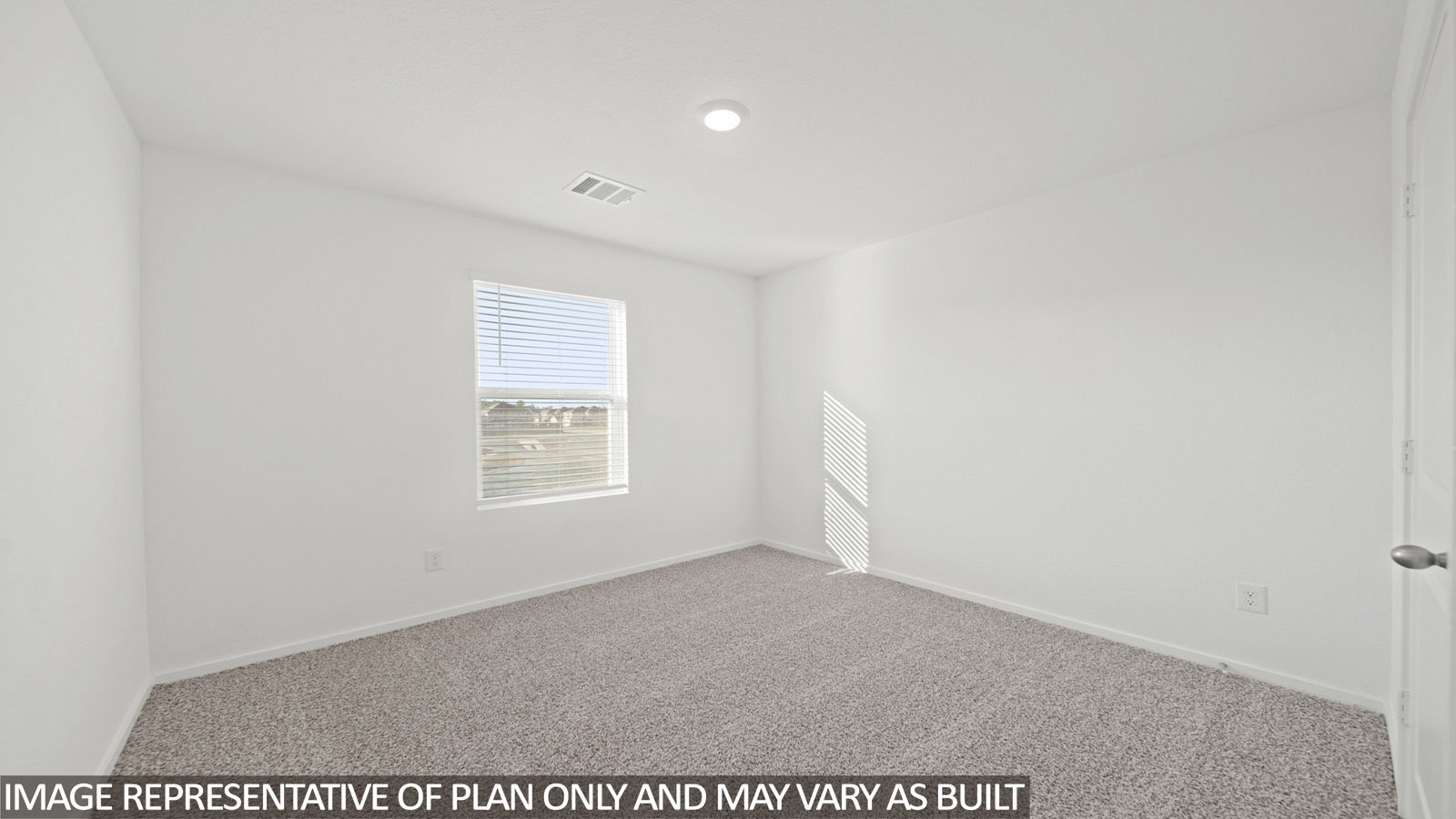 Iris secondary bedroom with carpeted flooring and window for natural lighting.