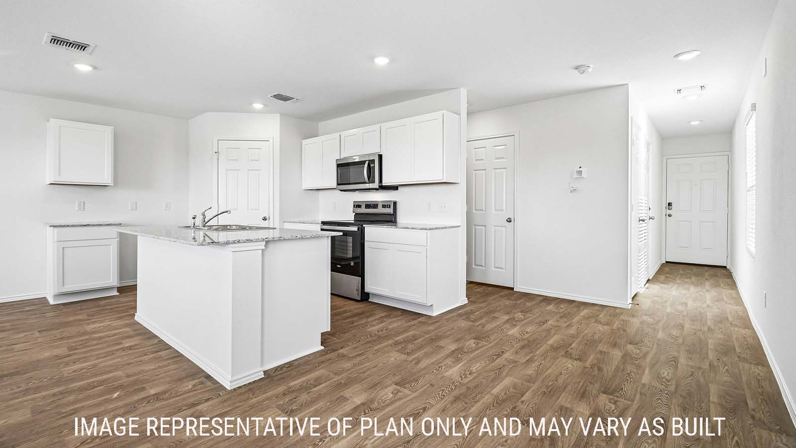Iris kitchen with kitchen island with white cabinets and view of front entry hallway.