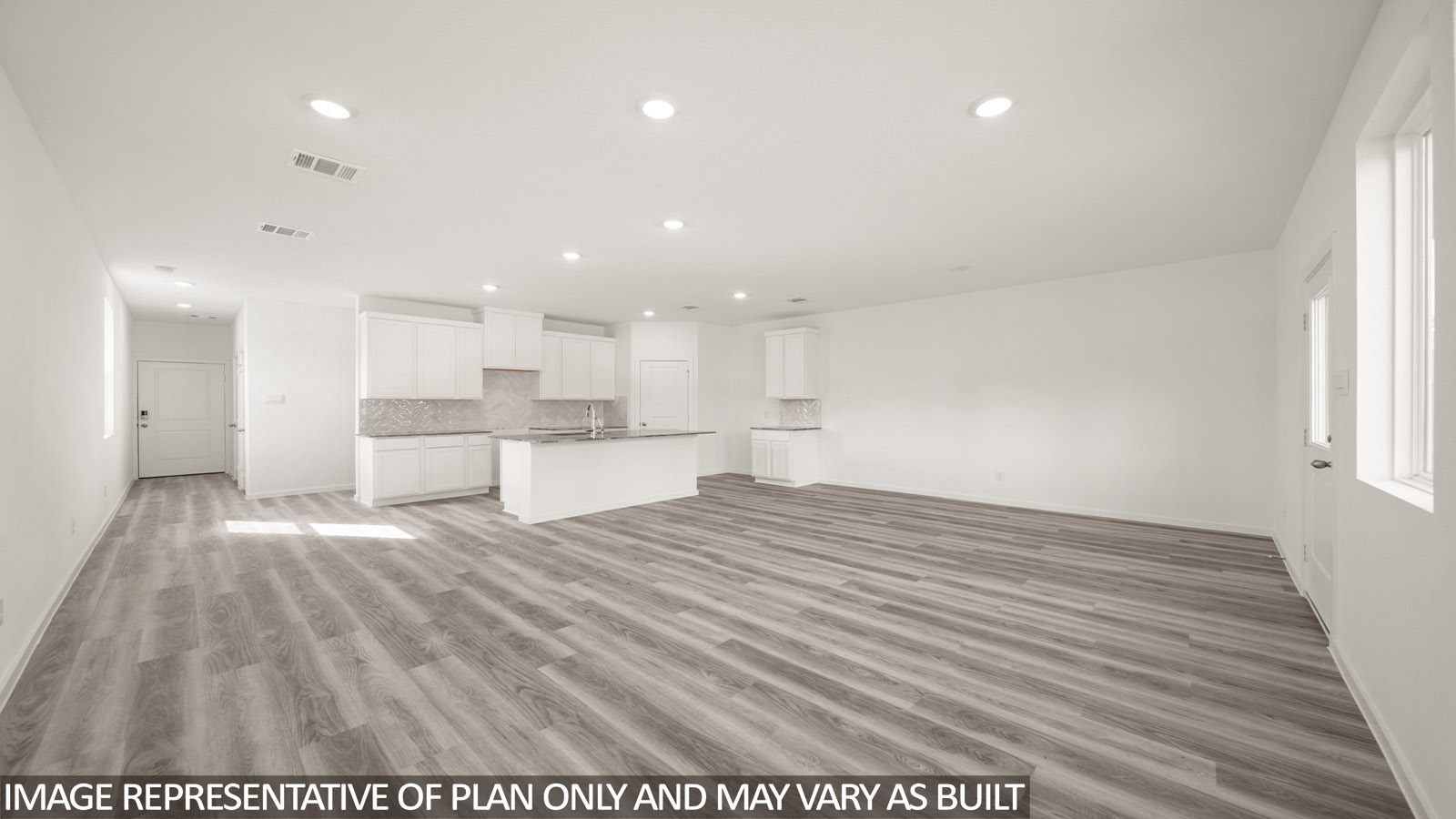 Jasmine living room with vinyl plank flooring and view of open concept kitchen and dining room.