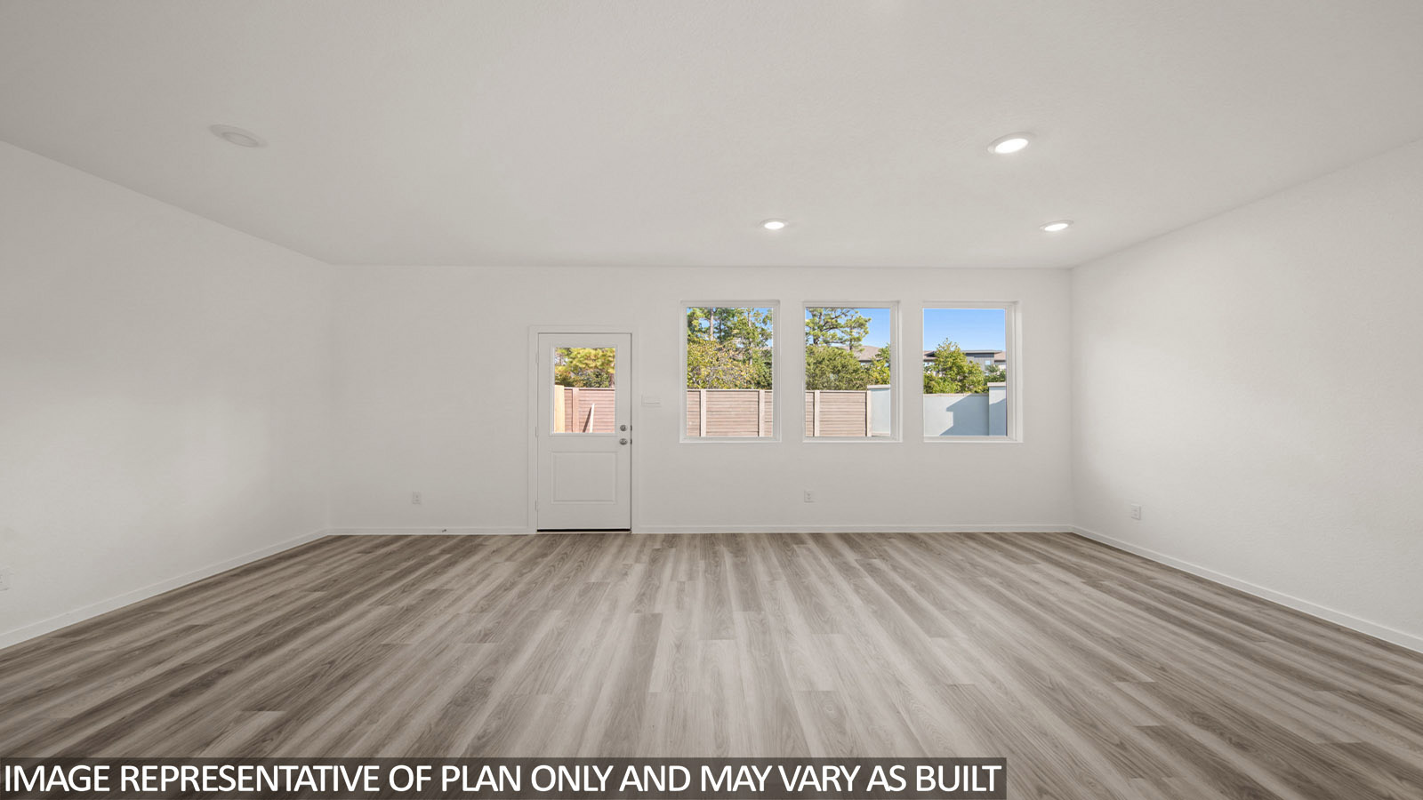 Jasmine living room with vinyl plank flooring and view of open concept dining room.