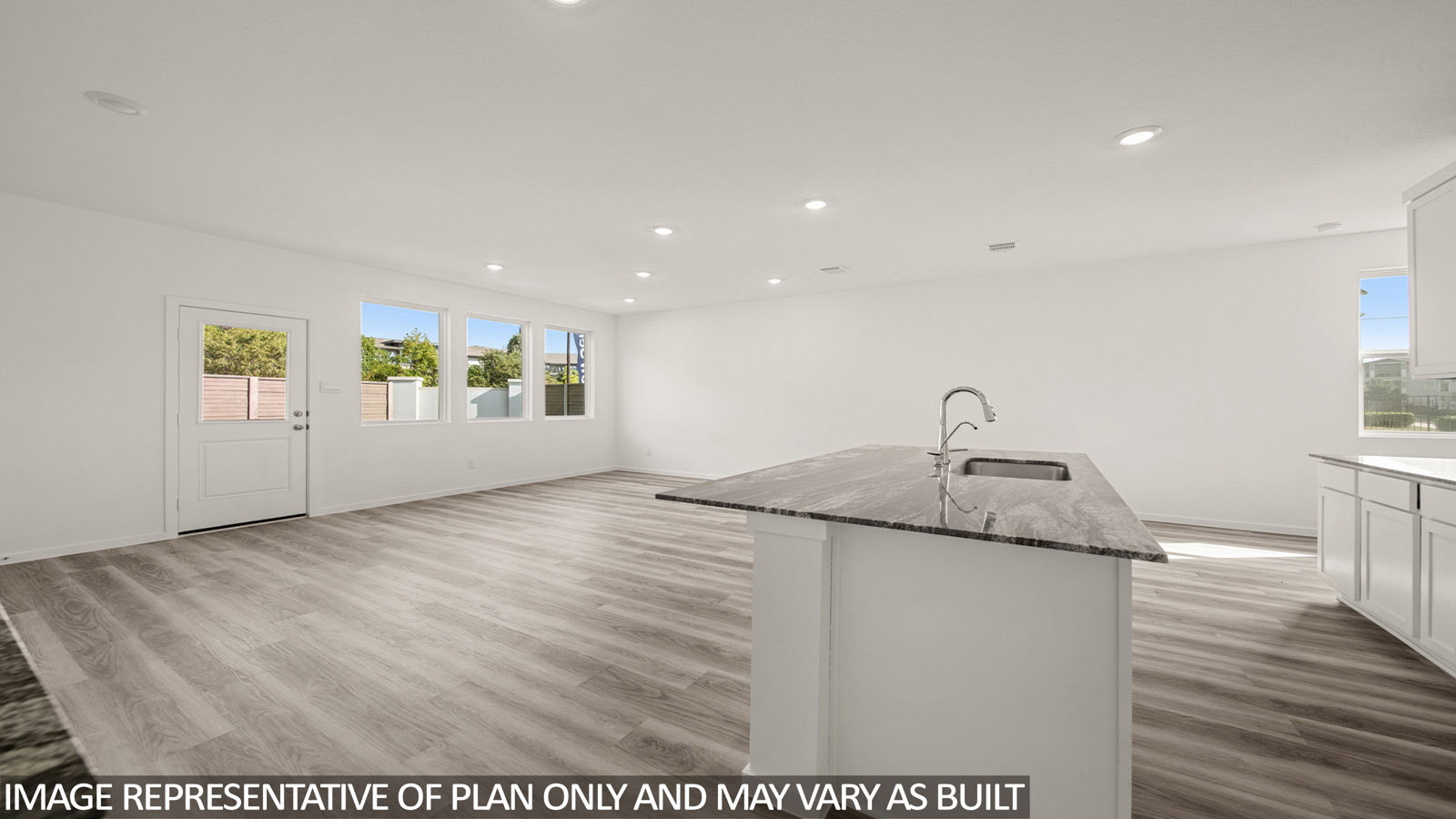 Jasmine kitchen with kitchen island with view of open concept dining room and living room.