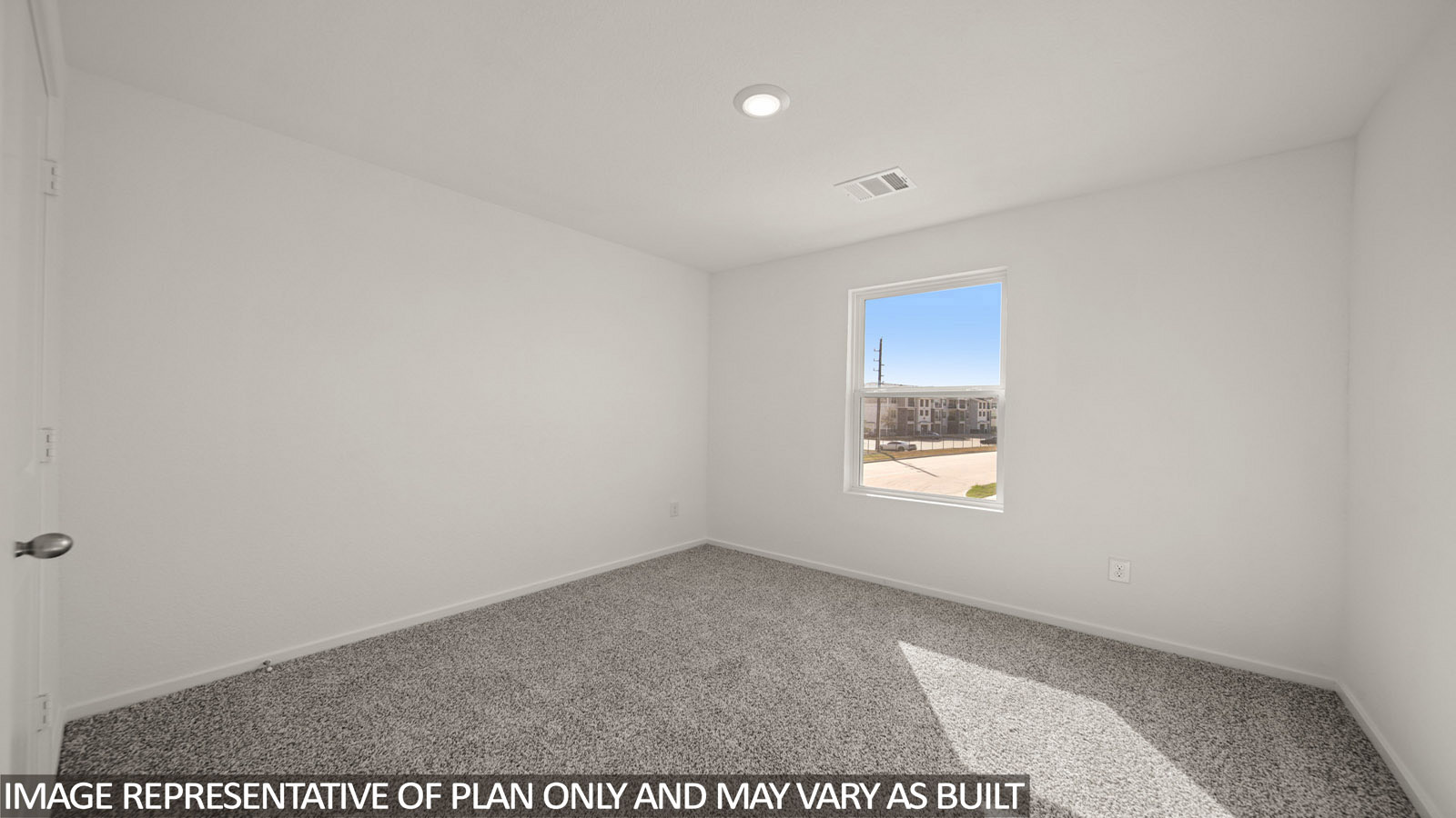 Jasmine secondary bedroom with carpeted flooring and window for natural lighting.
