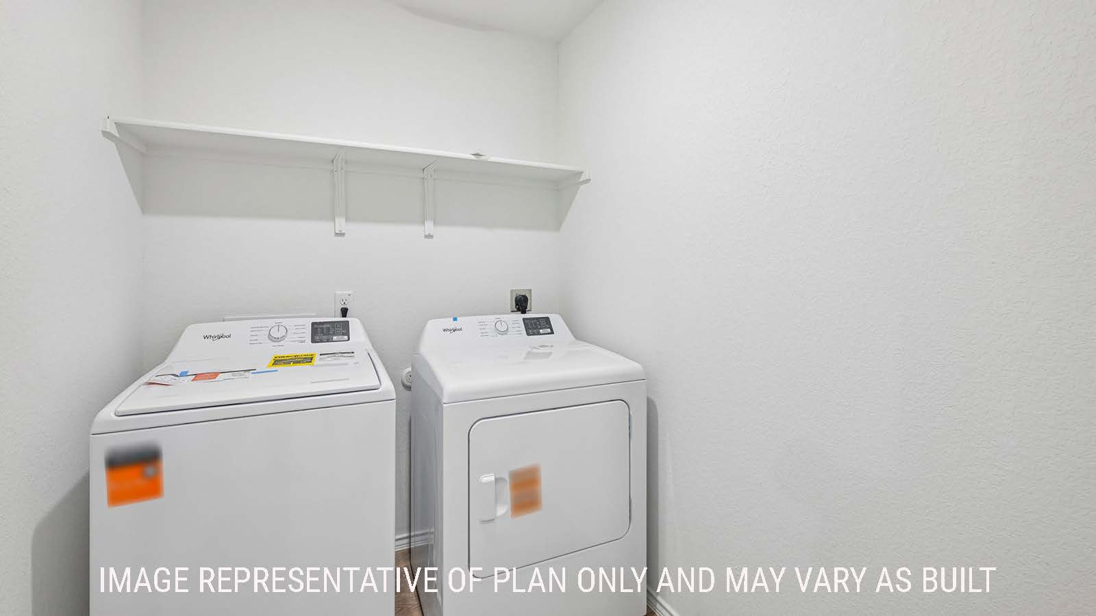 Jasmine utility room with washer and dryer with shelving for storage.