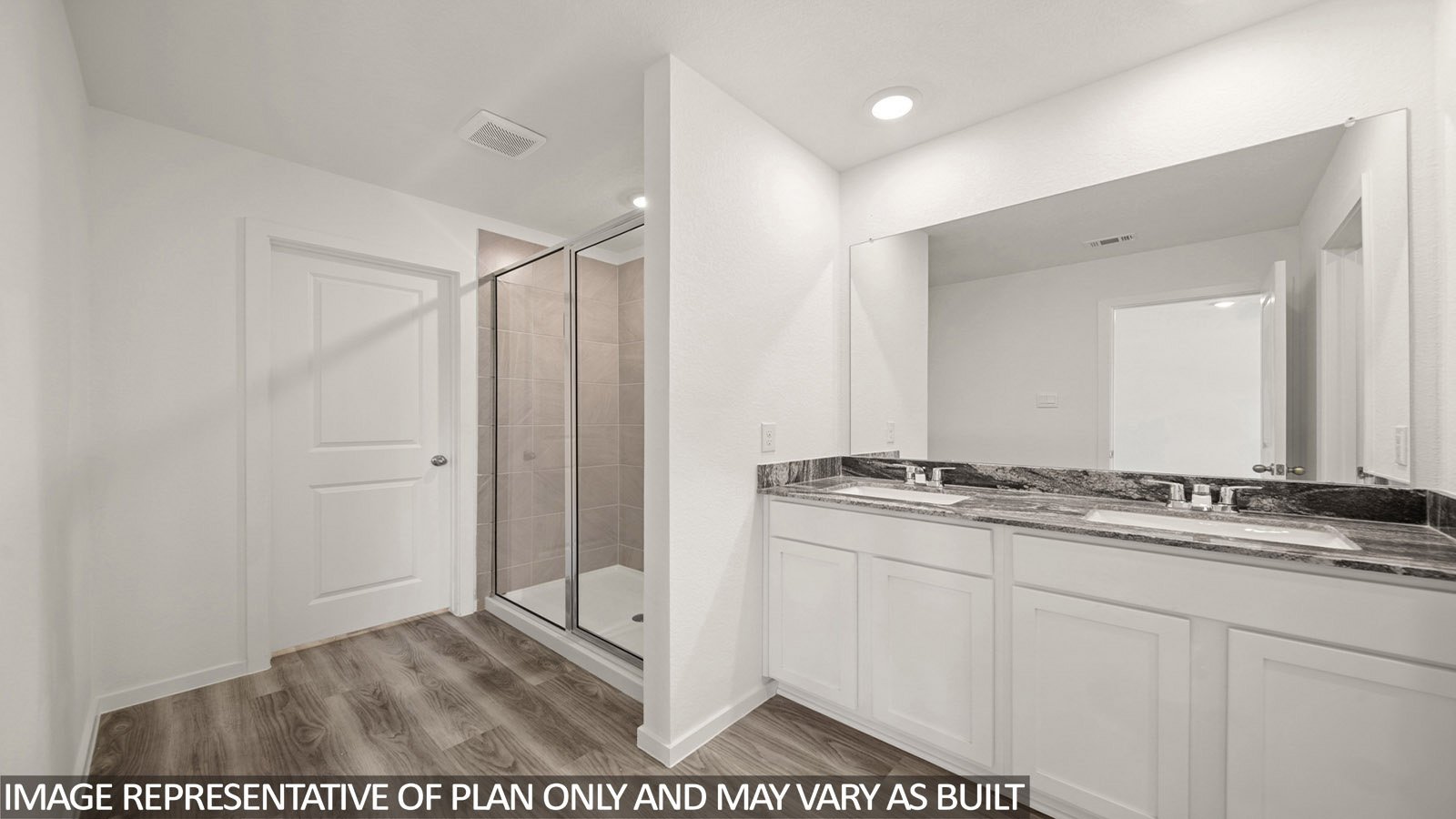 Jasmine primary bathroom with vanity sink and view of walk-in shower.