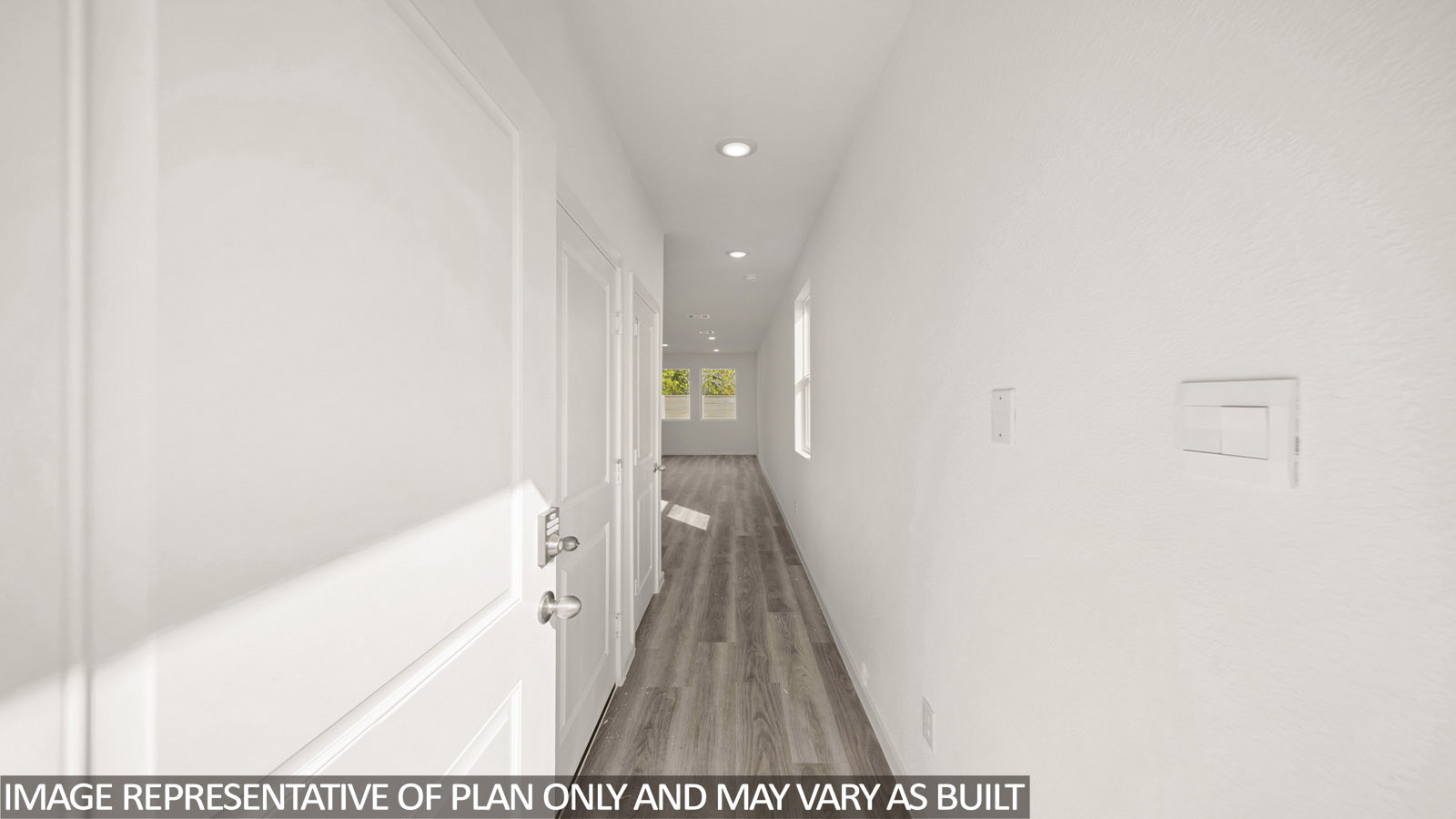 Jasmine entry with vinyl plank flooring and view of open concept living room.