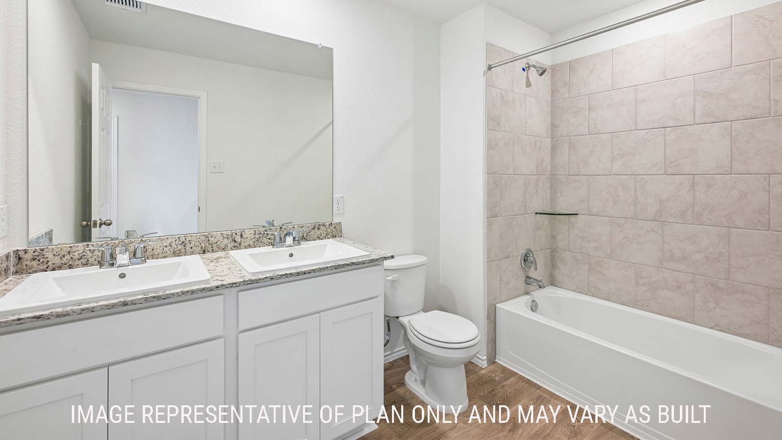Jasmine secondary bathroom with double vanity sink and shower and tub combo.
