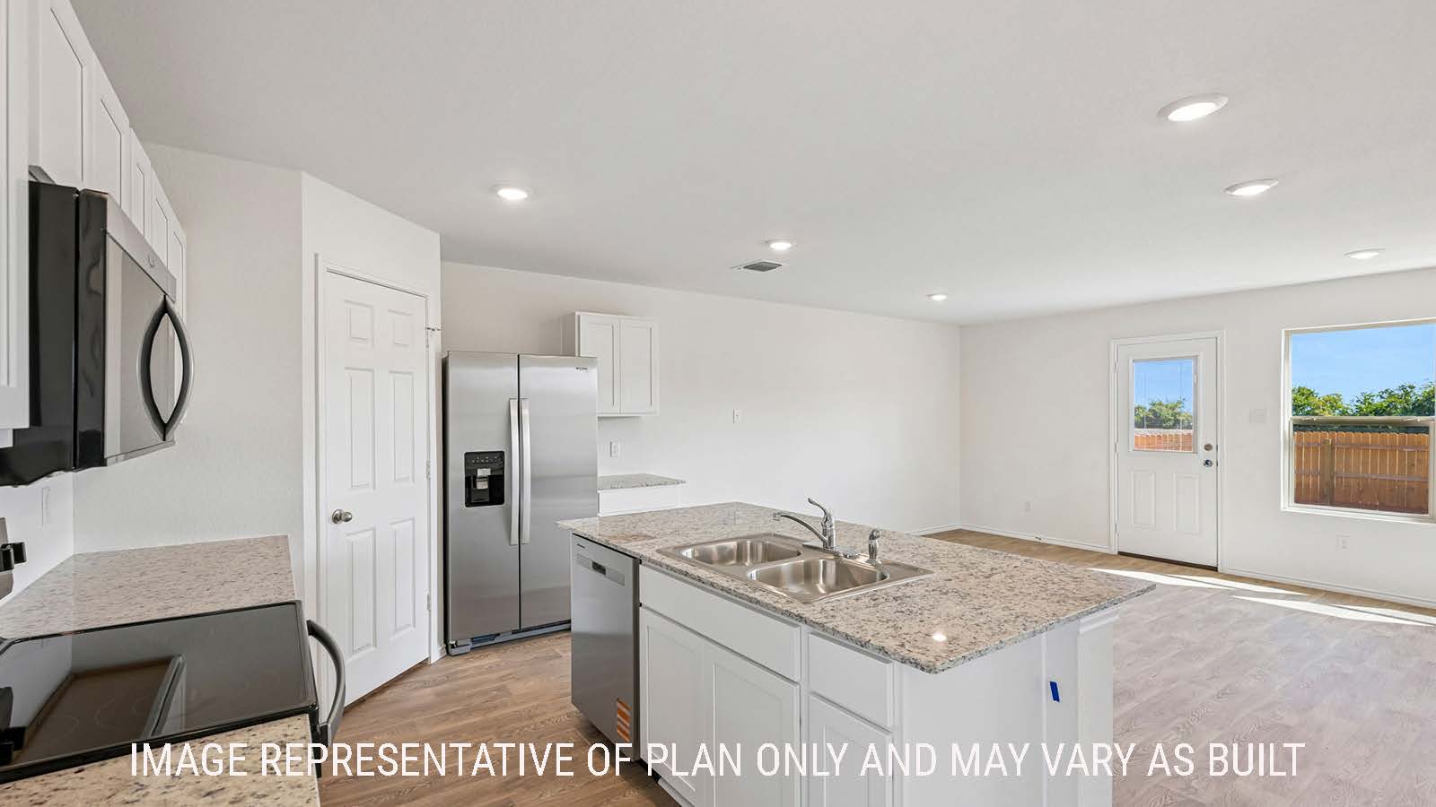 Jasmine kitchen with kitchen island with granite countertops and view of open concept dining room  and windows for natural lighting.