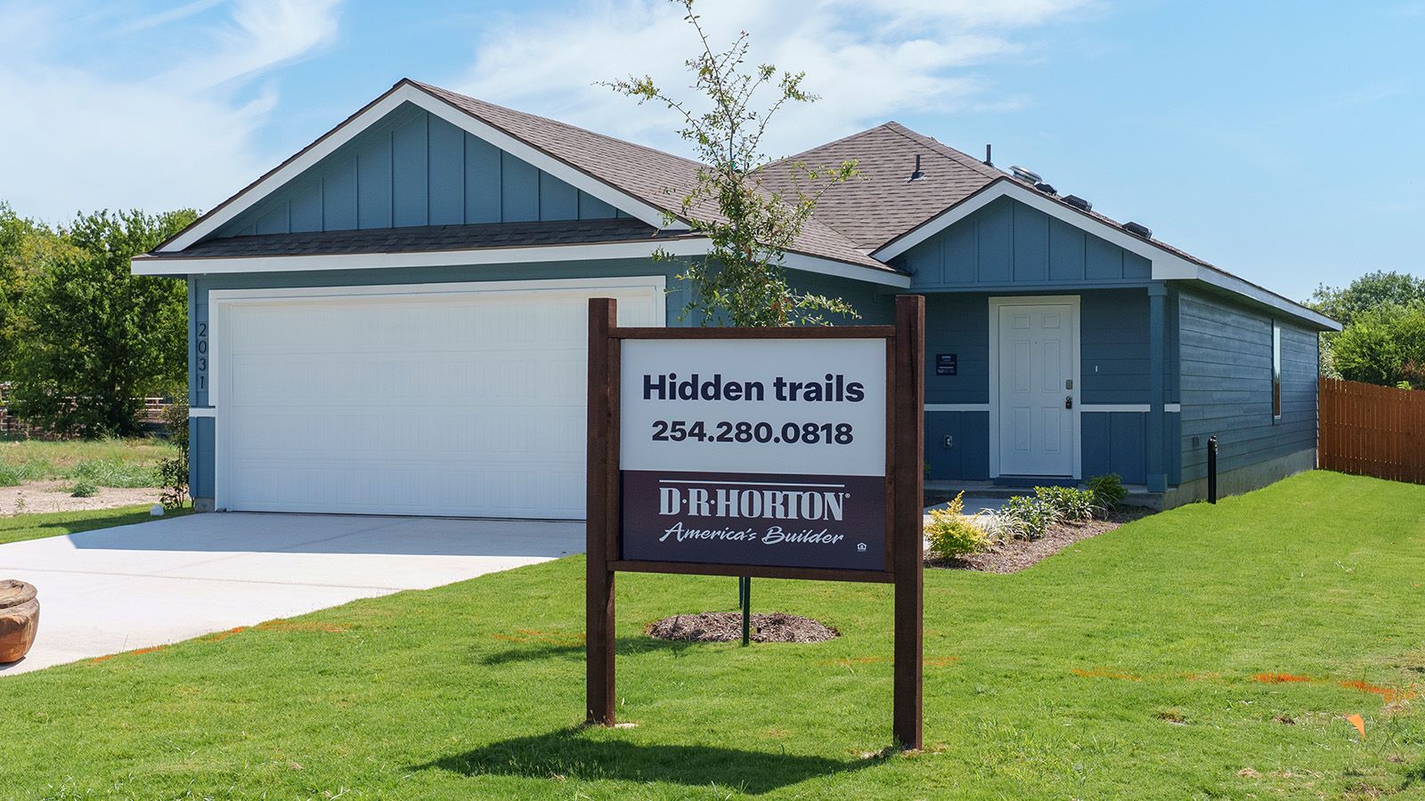 Hidden Trails Model Home front exterior with landscaping.