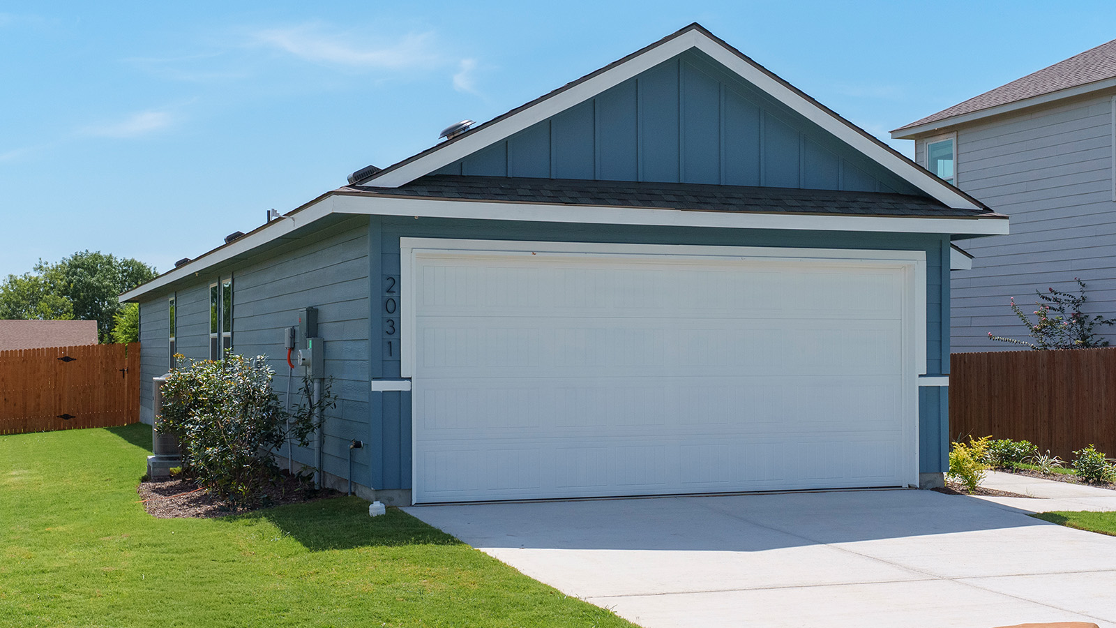 Hidden Trails Model Home front exterior with landscaping.