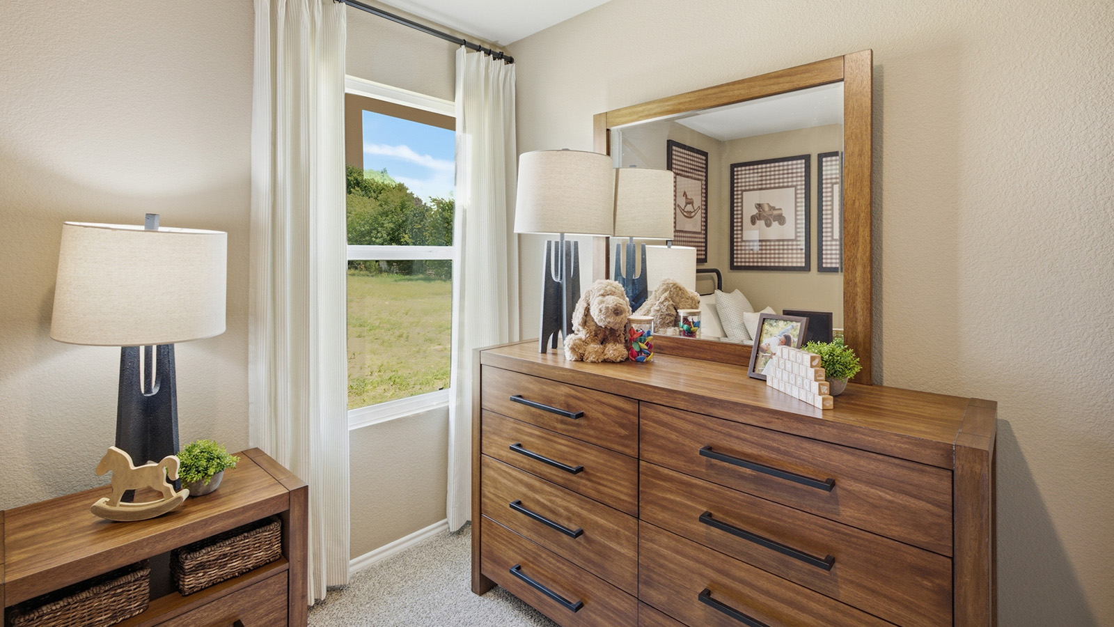 Hidden Trails Model Home secondary bedroom with carpeted flooring and view of hallway.