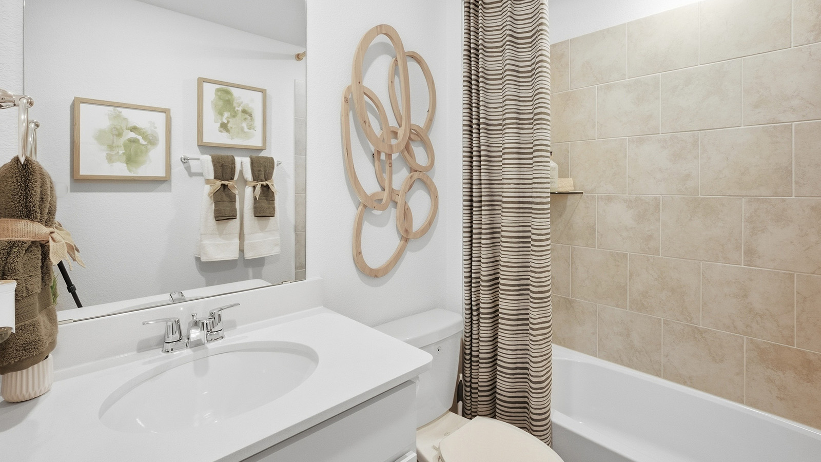 Wildwood Model secondary bathroom with vanity sink and shower and tub combo.