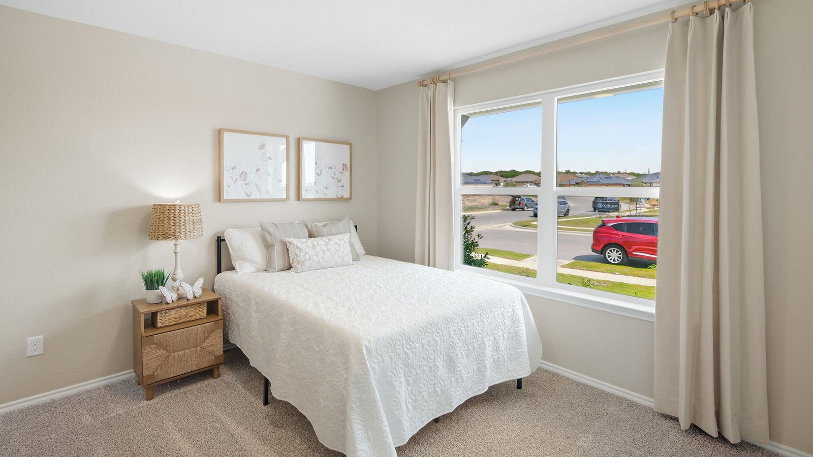 Wildwood Model secondary bedroom with carpeted flooring and windows for natural lighting.