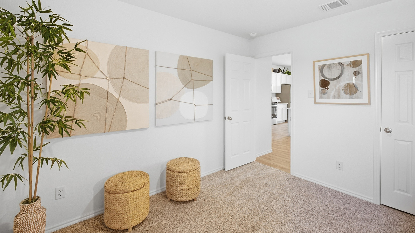 Wildwood Model secondary bedroom with carpeted flooring and view of hallway.