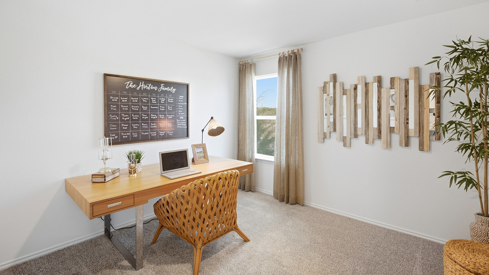Wildwood Model secondary bedroom with carpeted flooring and windows for natural lighting.