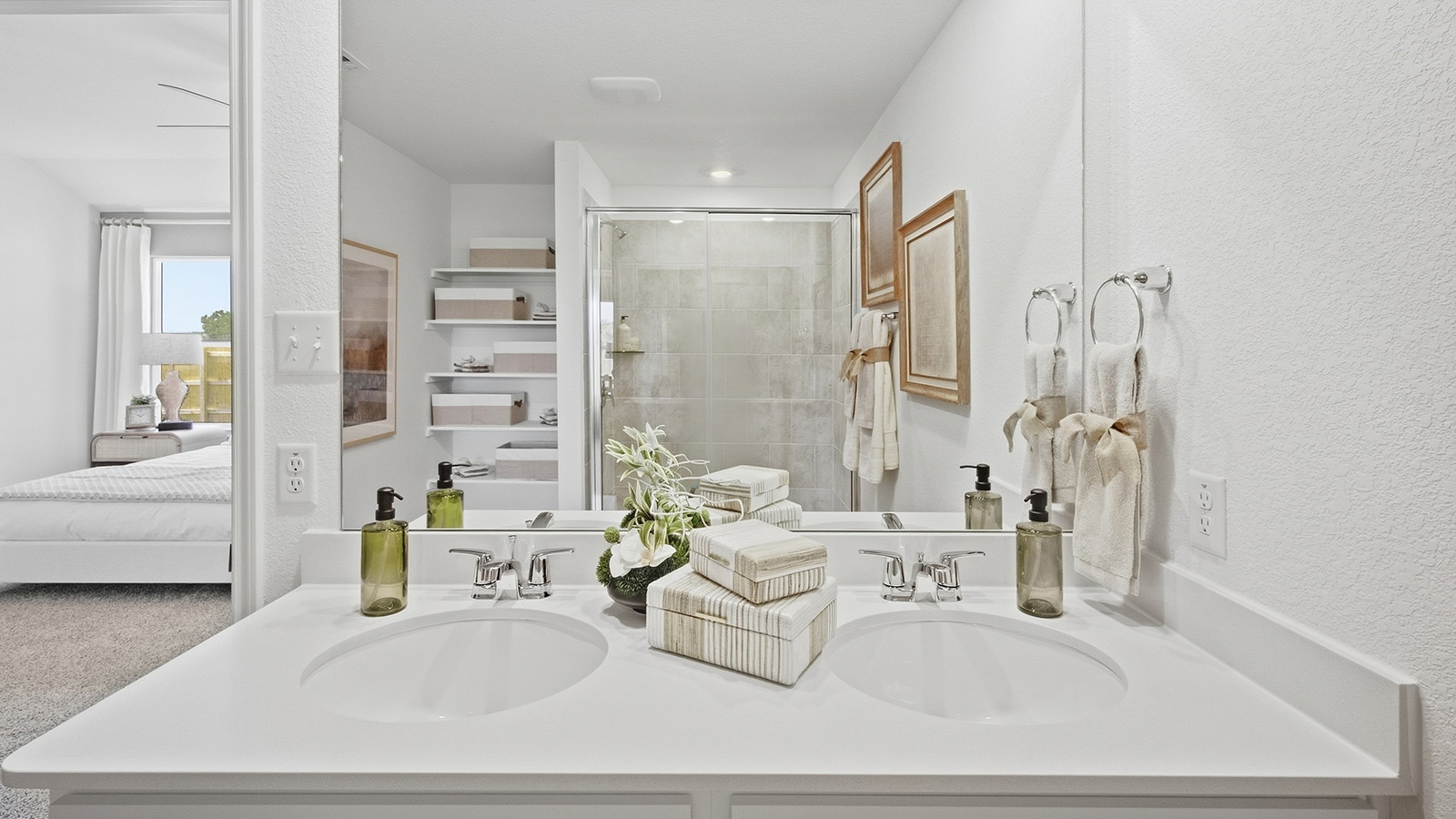 Wildwood Model primary bathroom with vanity sink and view of primary bathroom.