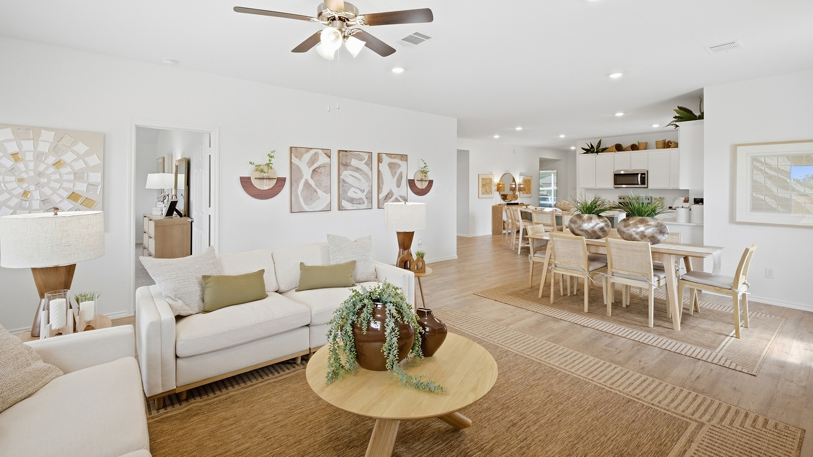 Wildwood Model living room with view of open concept dining room and kitchen.