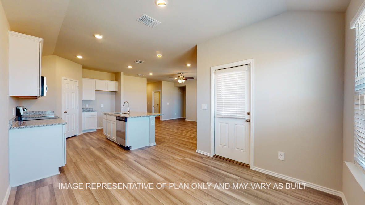 Fargo kitchen with kitchen center island with granite countertops.