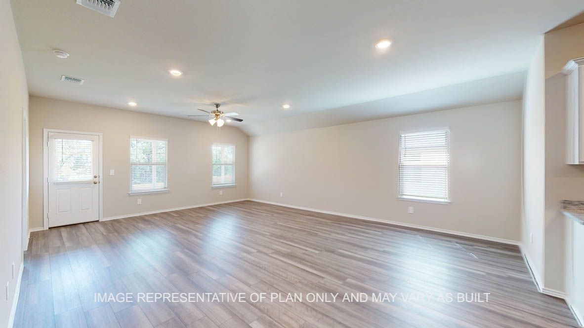 Kingston open concept dining room and living room with vinyl plank flooring throughout.