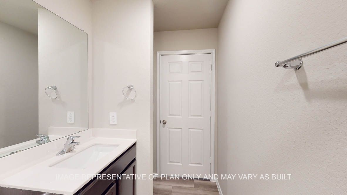 Kingston secondary bathroom with single vanity and mirror.
