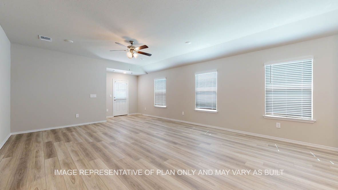 Seabrook living room with vinyl plank flooring with view into kitchen.