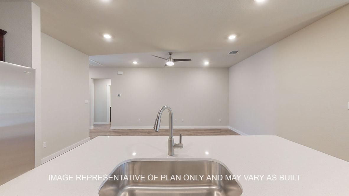 Baxtor large kitchen island with white quartz countertops.