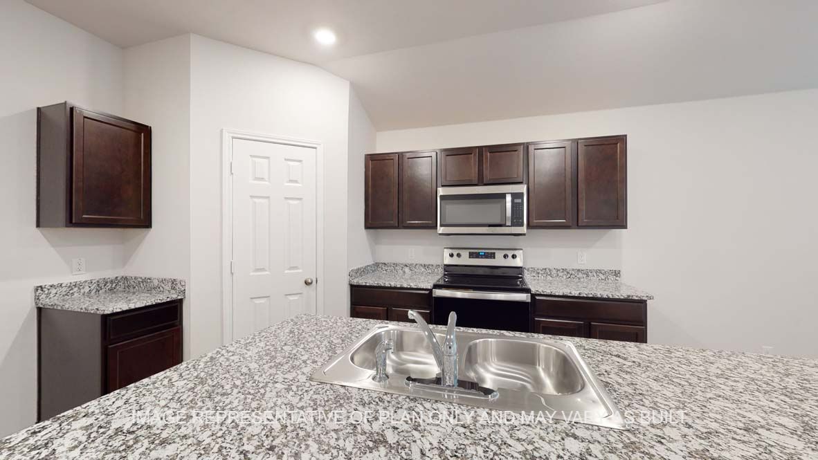Ashburn kitchen with center kitchen island with granite countertops.