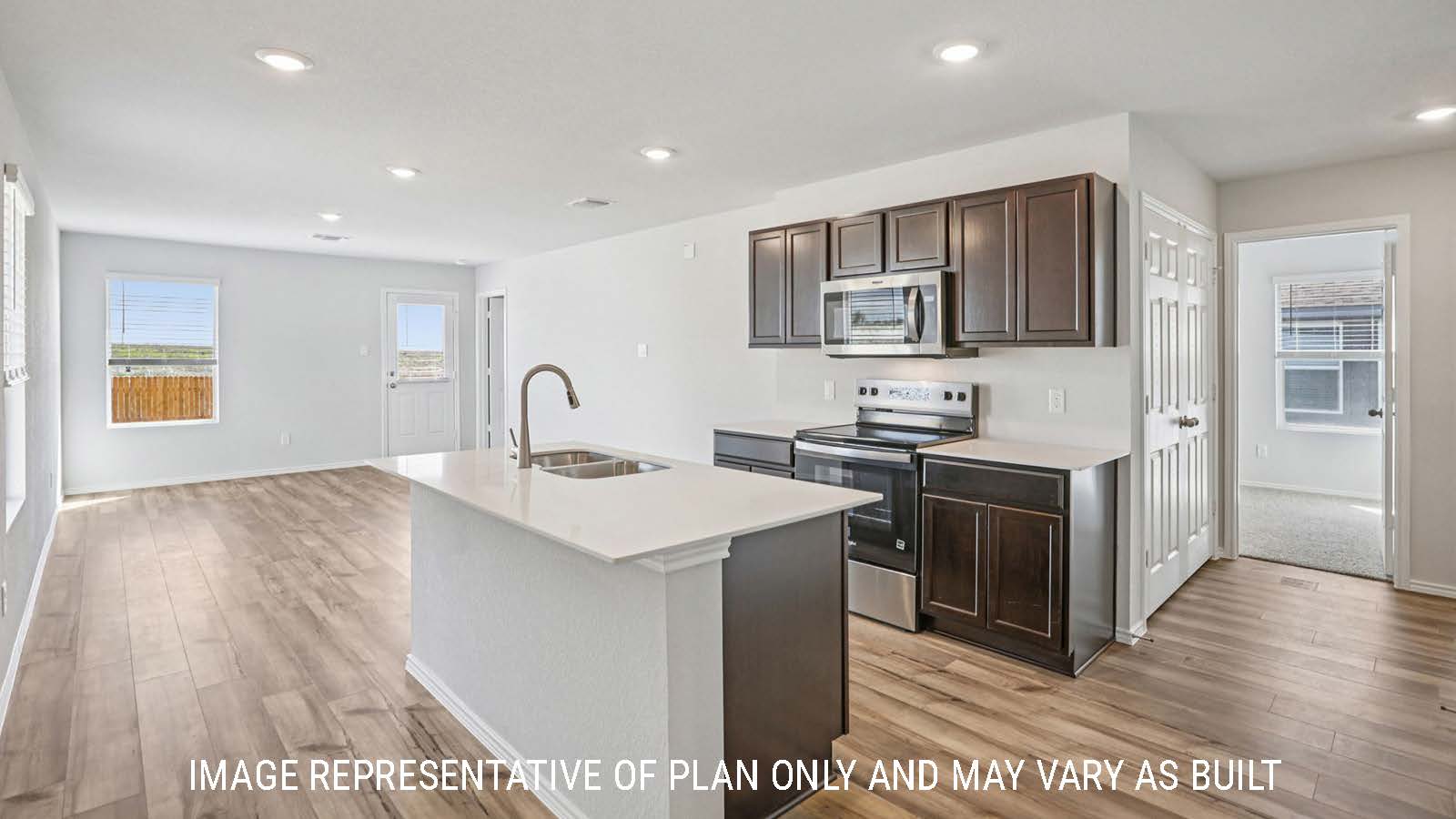Atlanta kitchen with kitchen island with granite countertops and dark cabinets.