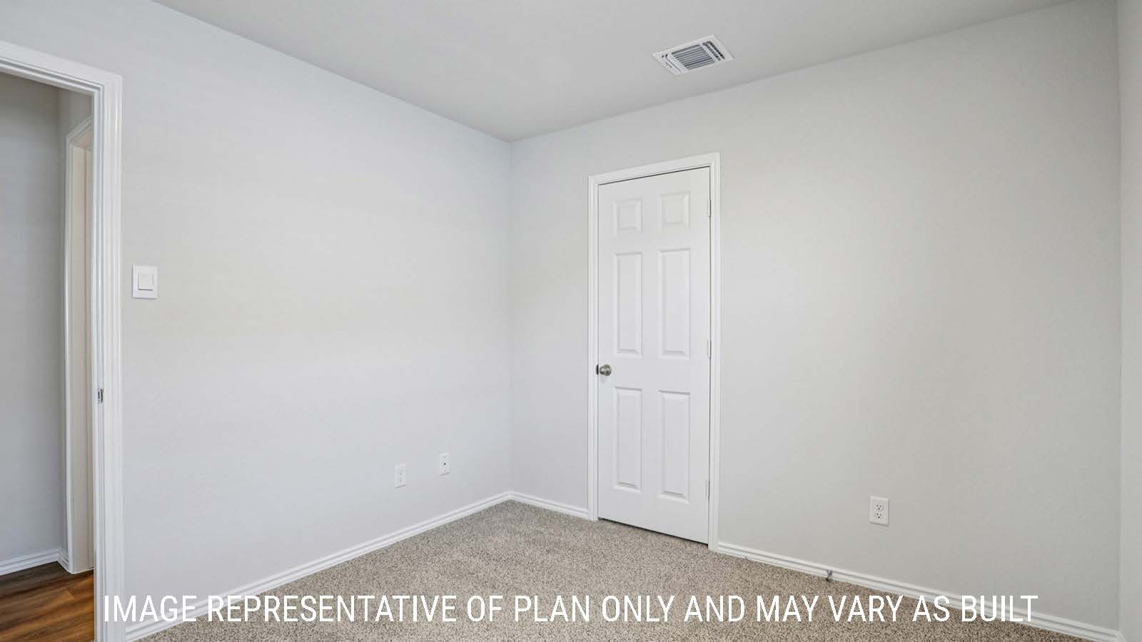 Barton secondary bedroom with carpeted flooring and view of hallway.