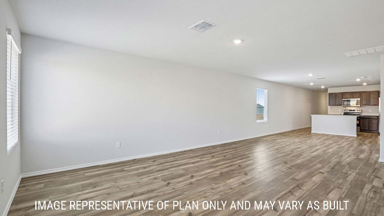 Caprock living room with vinyl plank flooring and view of open concept dining room and kitchen.