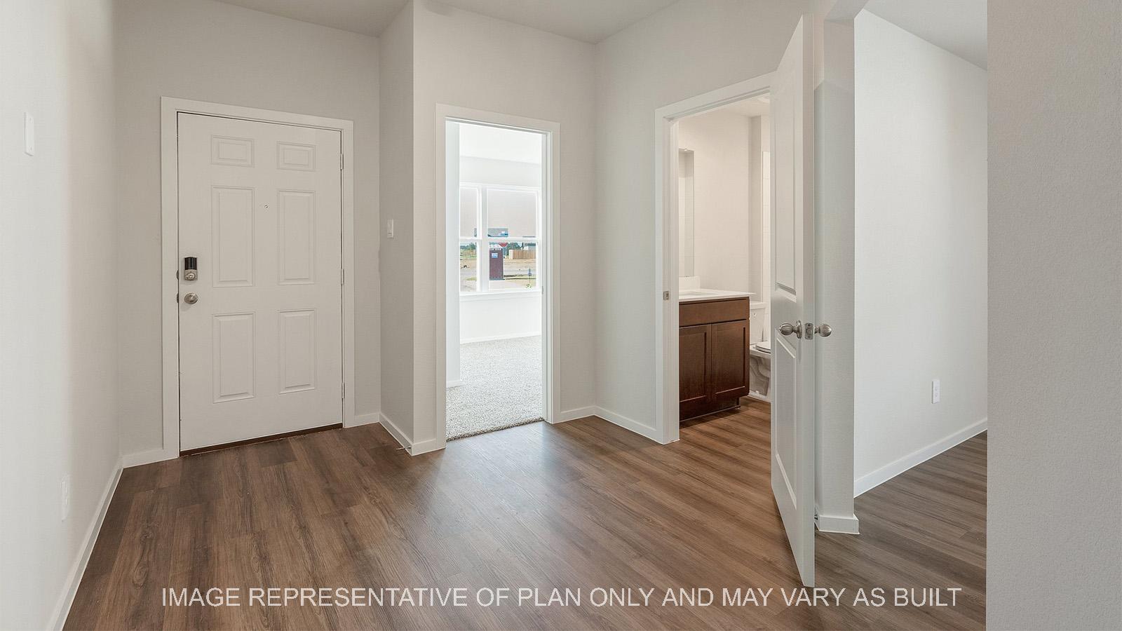 Lakeway entry way with view of secondary bedroom and secondary bathroom.