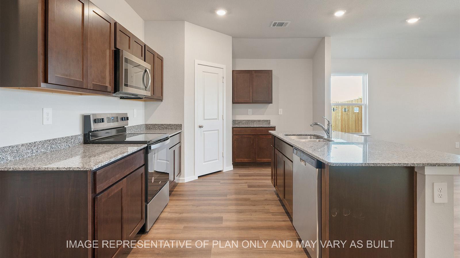 Lakeway kitchen with dark cabinets and kitchen island with view of living room.