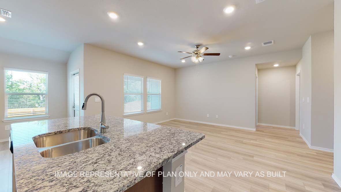 Bellvue open concept kitchen and living room with vinyl plank throughout.