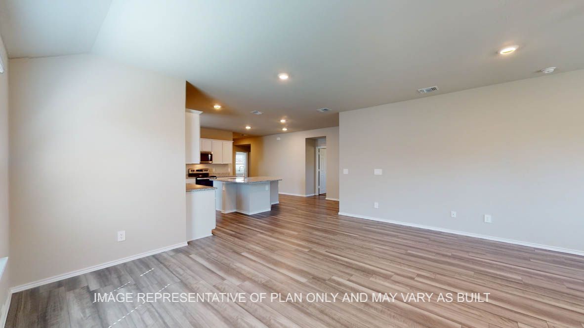 Kingston open concept dining room and living room with vinyl plank flooring throughout.