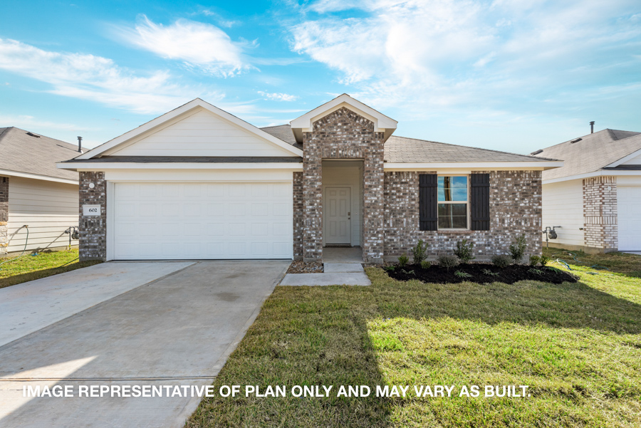 Single-story house with tan bricks and white highlights.