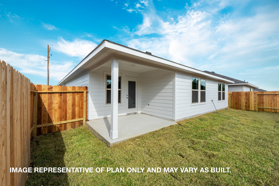 Landscaped backyard with patio.