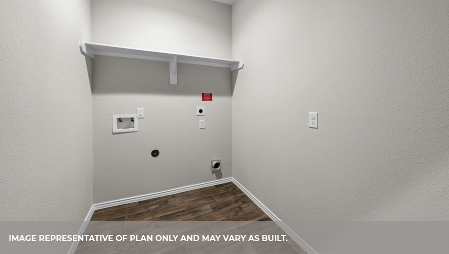 Utility room with overhead storage space.