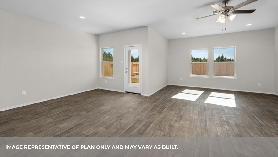 Open-concept living and dining space with vinyl flooring.