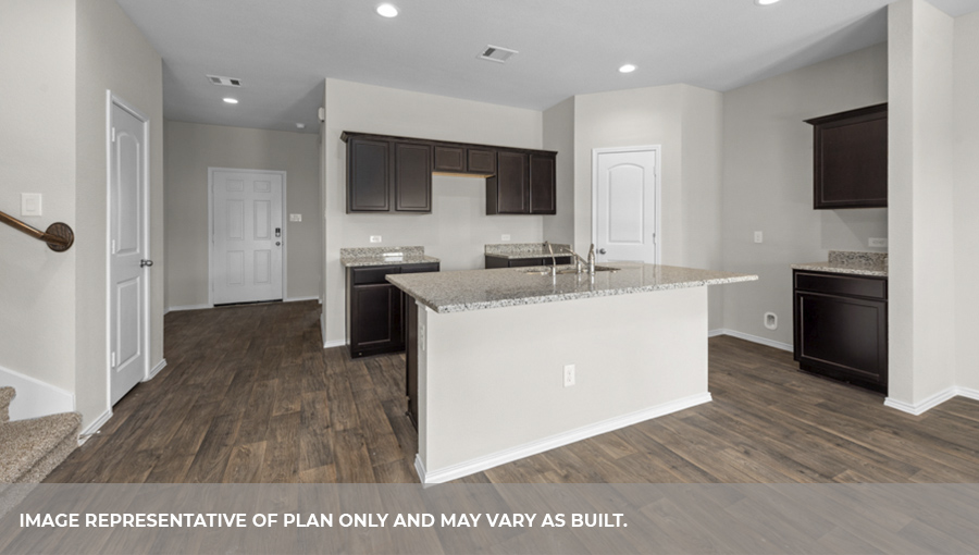 Kitchen with island and stainless-steel appliances.
