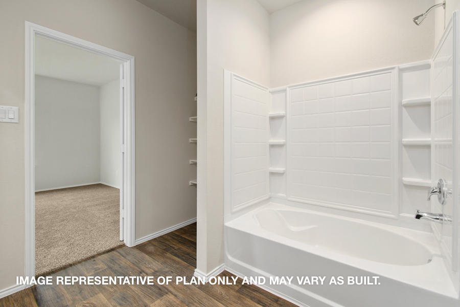 Primary bathroom with standing shower.