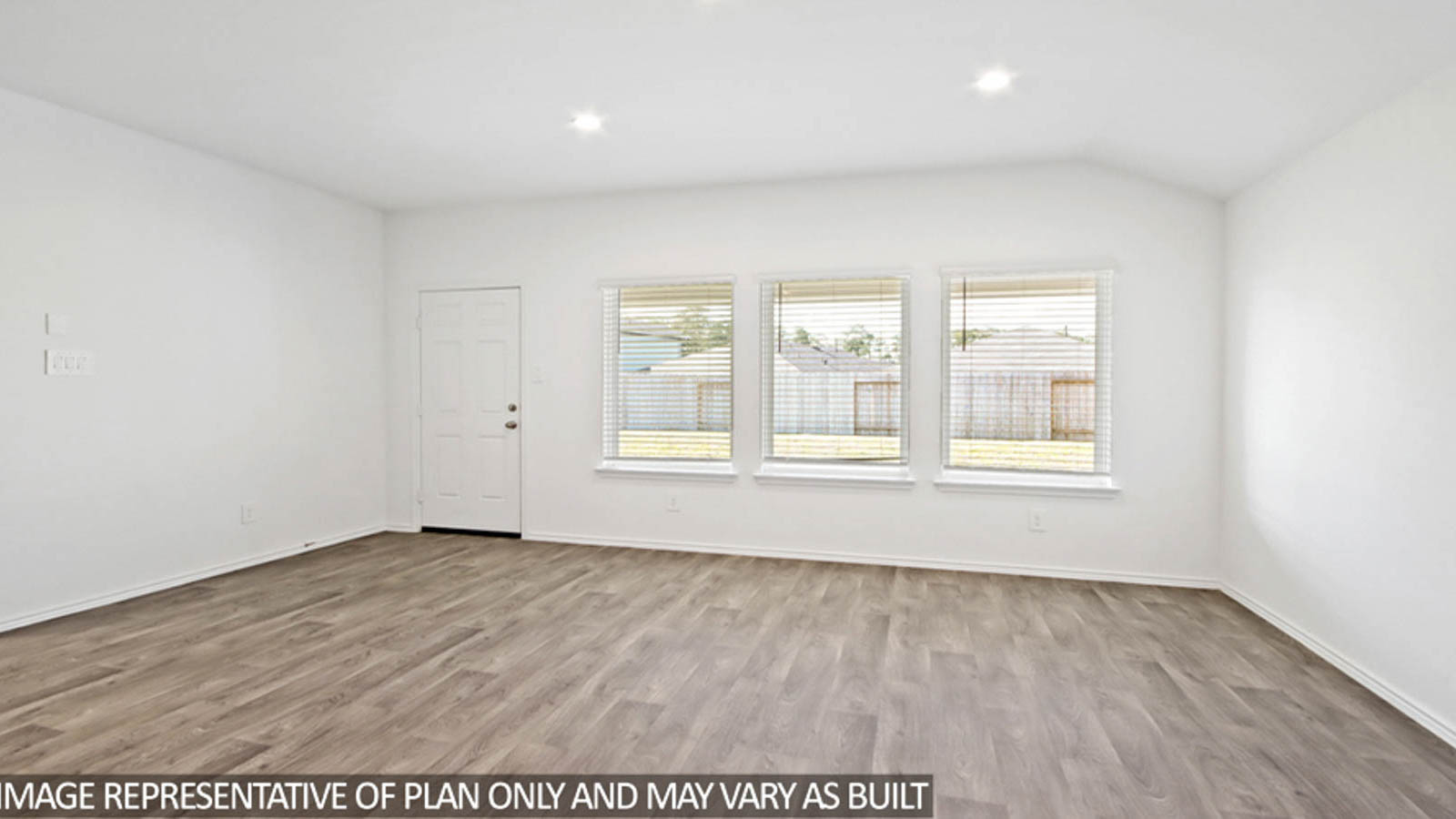 Spacious living area with vinyl flooring and bright windows in Conroe TX
