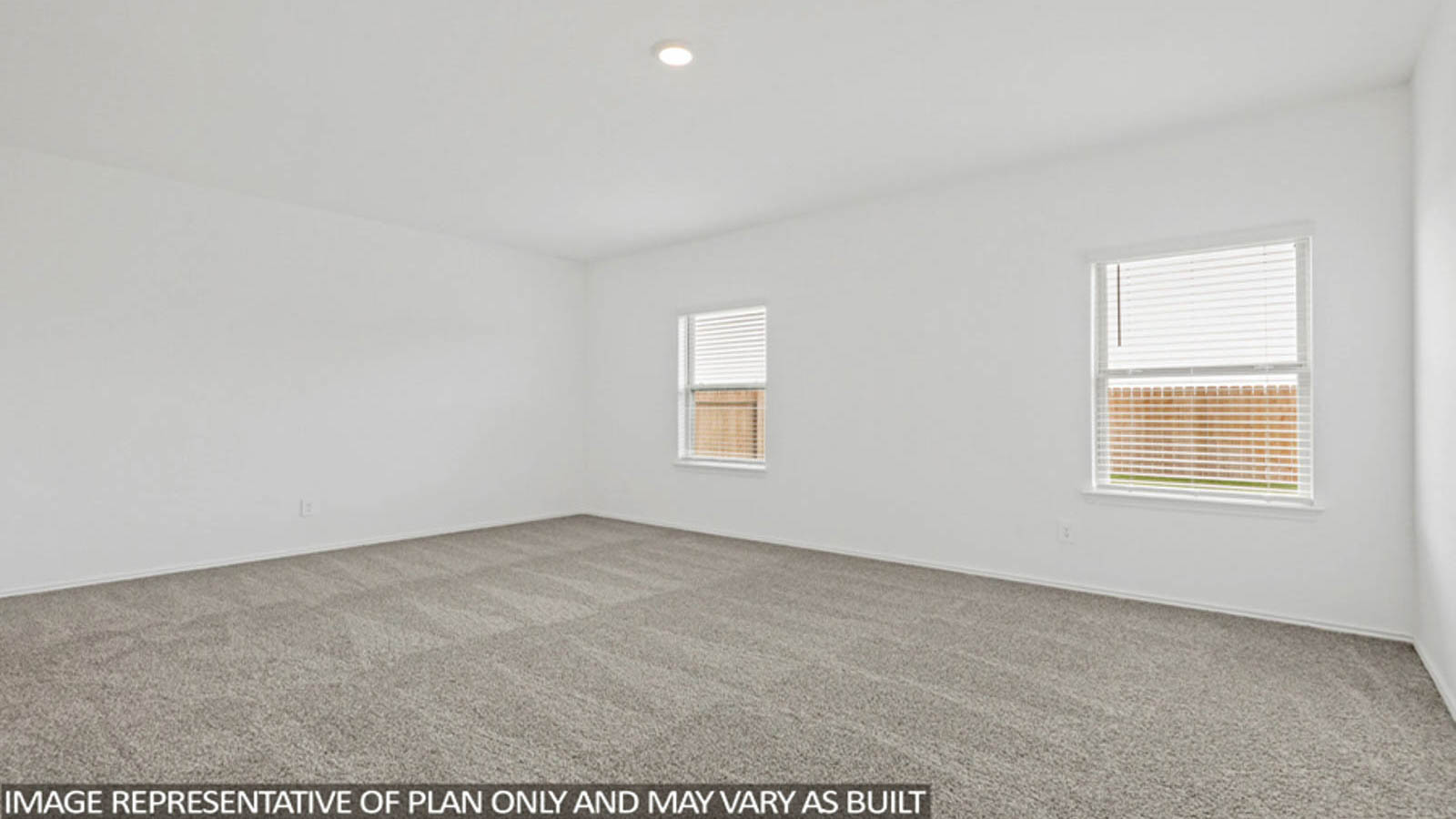 Large Primary bedroom with shag carpet flooring and bright window