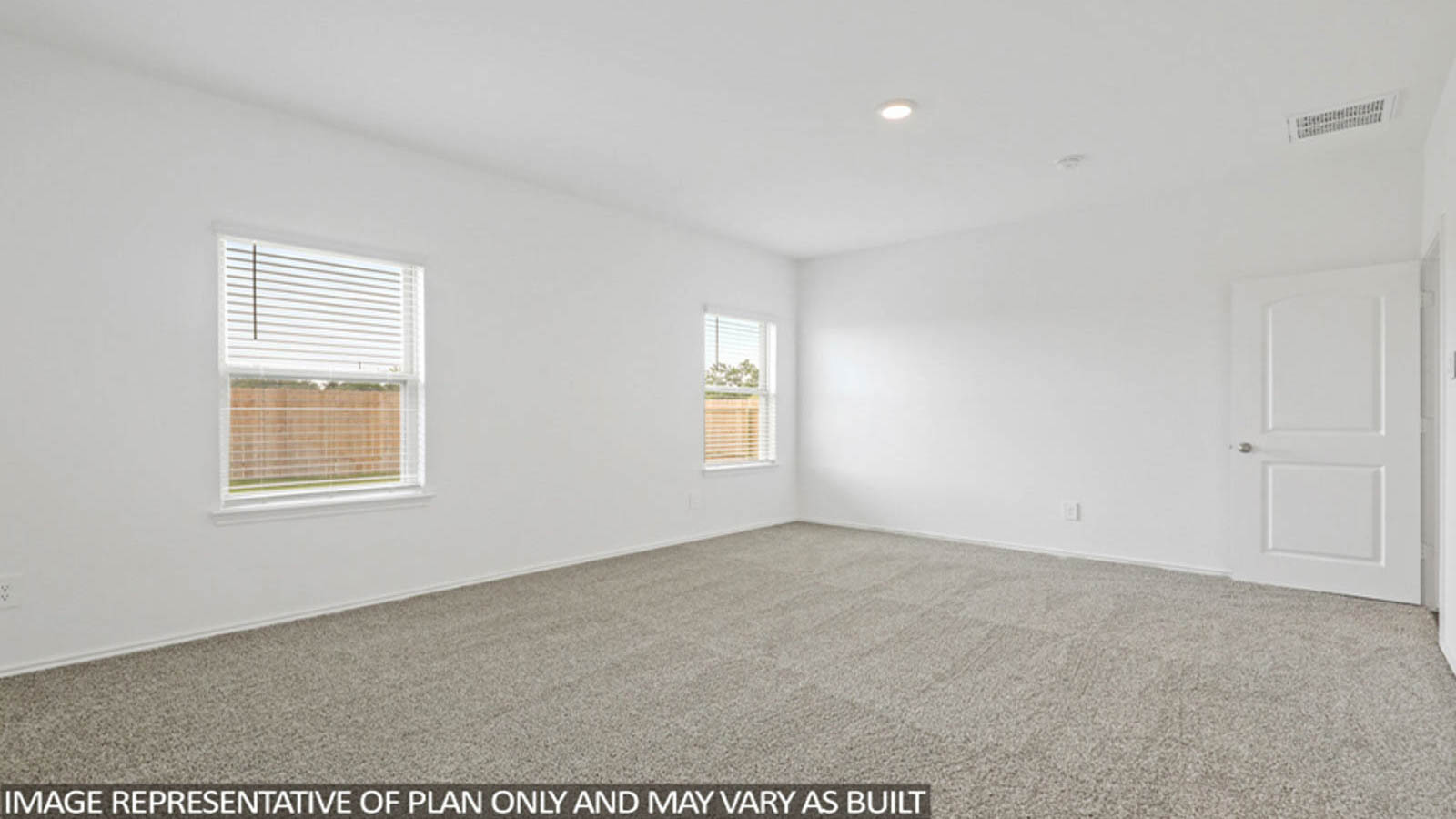Large Primary bedroom with shag carpet flooring and bright window