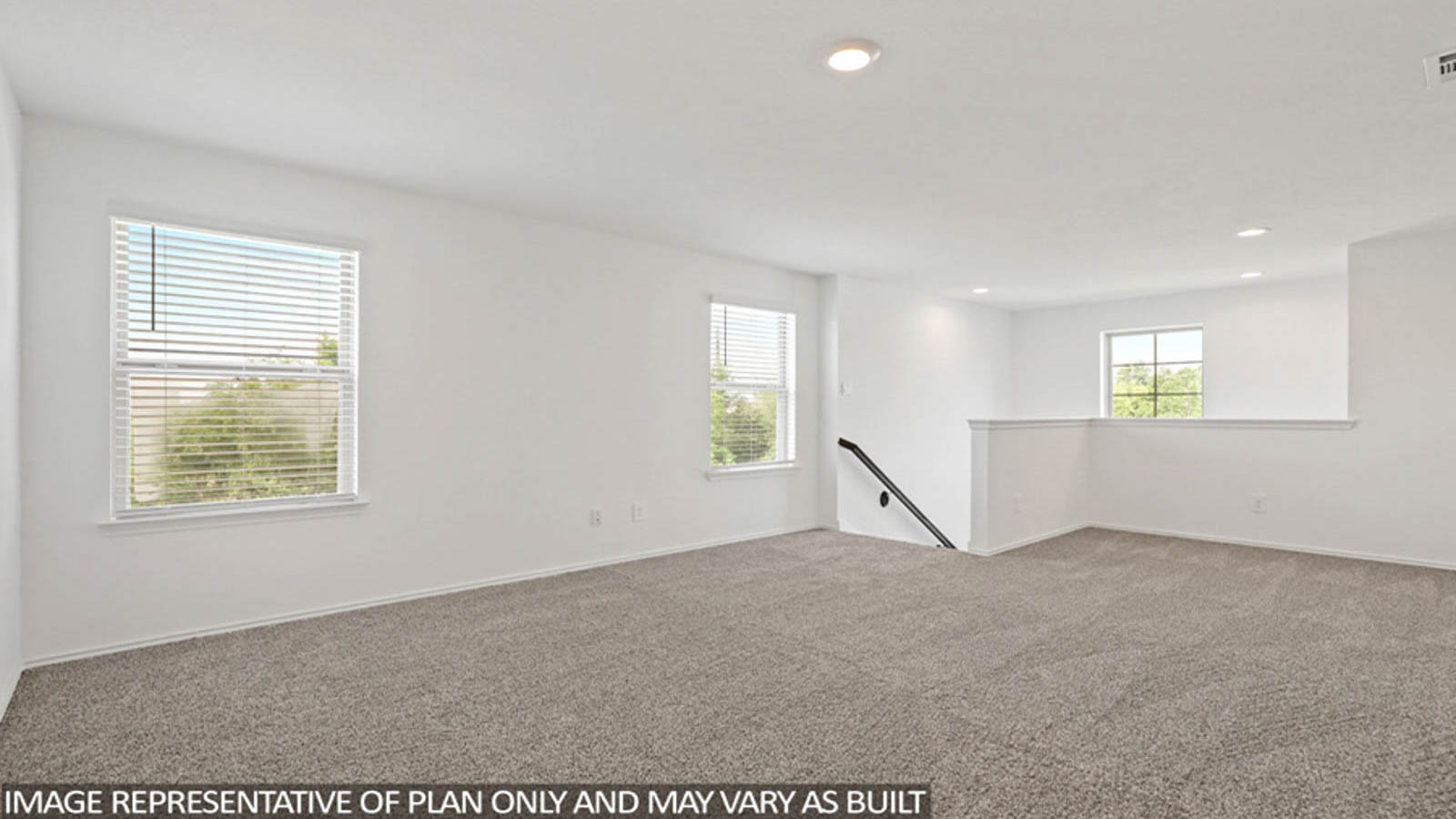 Second story game room with carpet flooring with bright windows in this multi functional space in Conroe TX
