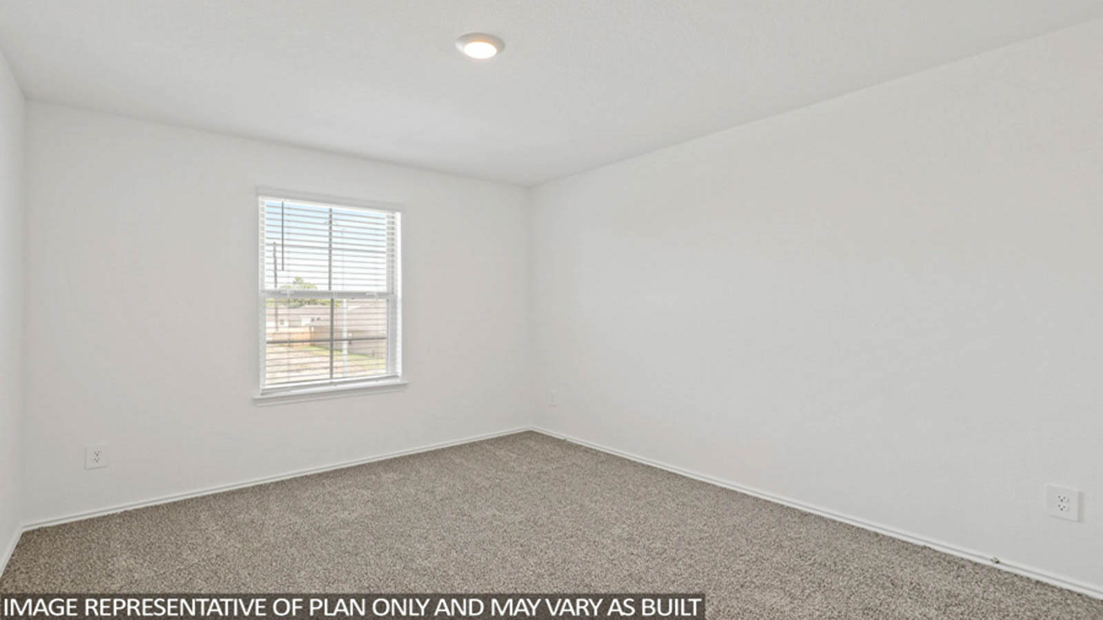 Second level secondary bedroom with carpet flooring and bright window