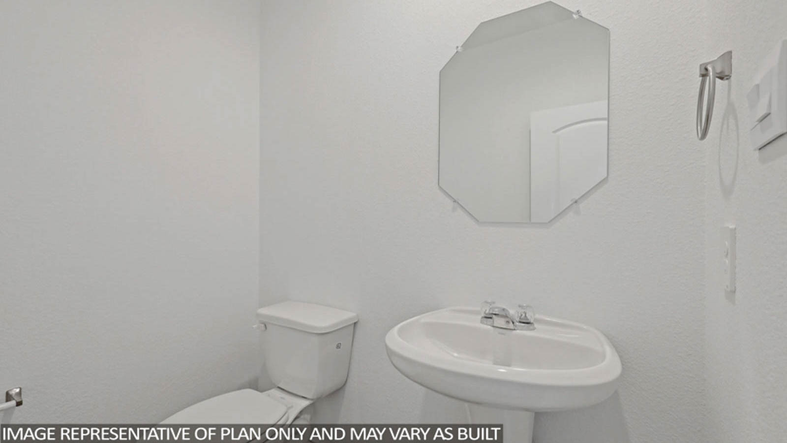 Powder bathroom with pedestal sink right off the foyer entry hallway