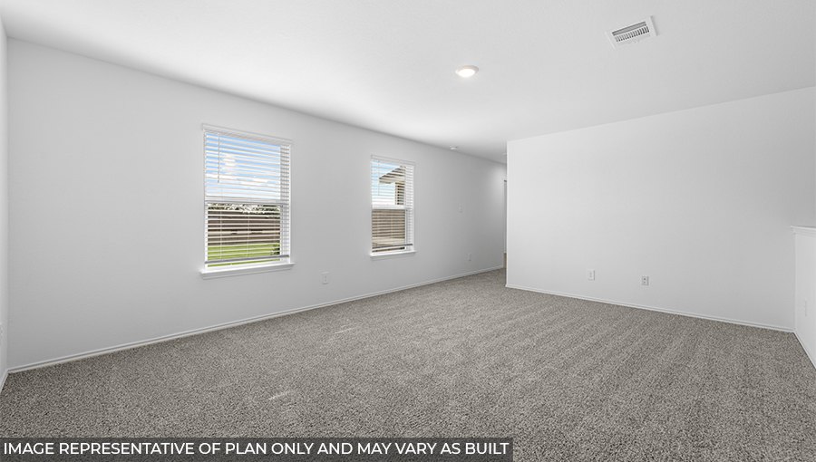 Second story game room with carpet flooring with bright windows in this multi functional space in Conroe TX