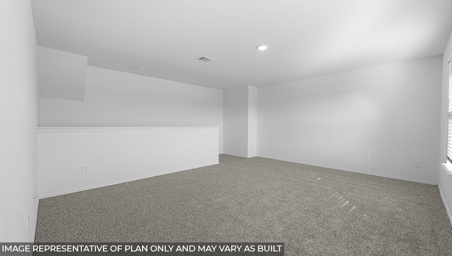 Second story game room with carpet flooring with bright windows in this multi functional space in Conroe TX