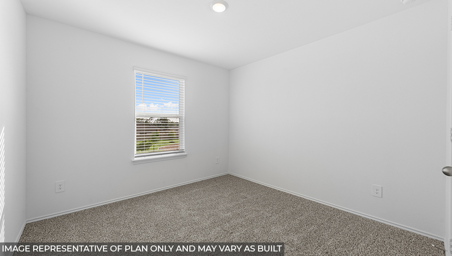 Secondary bedroom with shag carpet flooring and bright window