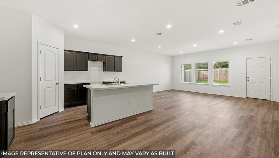 Spacious living area with vinyl flooring and bright windows in Conroe TX